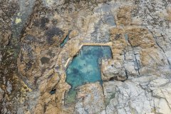 Aerial view of Trevone natural sea pool, Trevone Bay, Cornwall, UK.