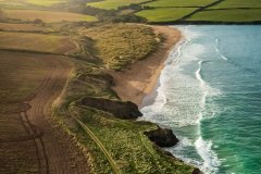 Aerial view of Harbour Cove beach, Padstow, Cornwall, UK.