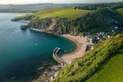 Aerial view of Yacht, Polkerris Harbour, Cornwall, UK.