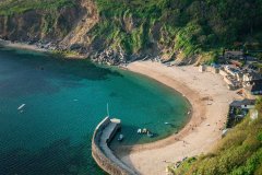 Aerial view of Yacht, Polkerris Harbour, Cornwall, UK.