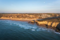 Aerial view of Holywell Bay, at sunset, Cornwall, uk