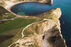 Aerial view of Lulworth Cove, Stair Hole, Dorset, UK.